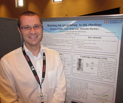 Damien with his poster at the conference