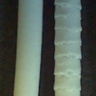 Extrudates of microcrystalline cellulose water-based paste (3 mm die diameter). The difference in appearance is due to the extrusion velocity - a higher velocity induces surface fractures