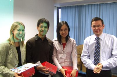loreal Melanie Hoehl, Yazid Jalani and Lu Zhao with the chief engineer of the L'Oréal Llantrisant factory