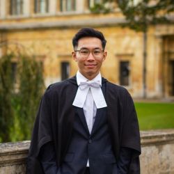 Muhamad Hartono in back suit with white shirt and judge-style bowtie