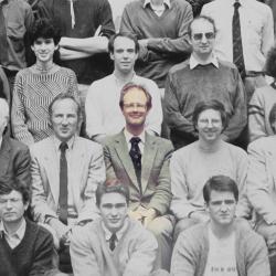 Black and white department staff and student photo with Bill Morton in colour in middle of shot