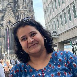Rachana Acharya with church (Sagrada Familia) in the background
