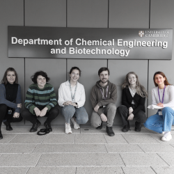 Six people crouched down in casual clothing under the department name outside. Photo lightly greyed except for Sofia on the far right.