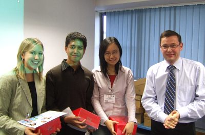 Melanie Hoehl, Yazid Jalani and Lu Zhao with the chief engineer of the L'Oréal Llantrisant factory