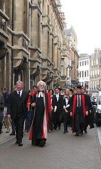 Magdalene College, led by the Master, Dr Rowan Williams (with umbrella)