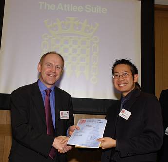 Matthew Lim (on the right) receiving the Rolls Royce Award in Engineering Science from Dr David Clarke, Rolls Royce, at the House of Commons in 2004  Photo by Frank Dumbleton