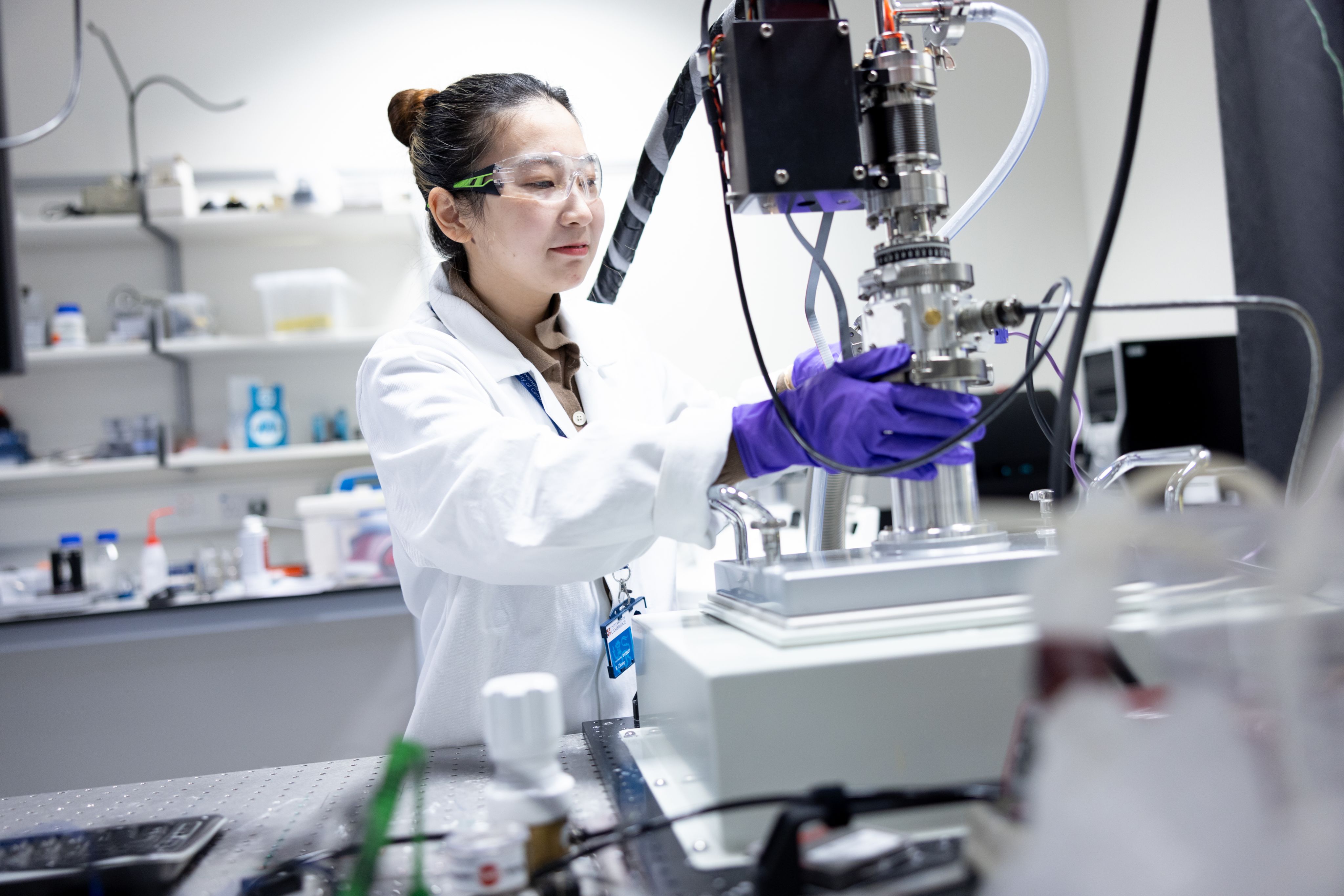 CEB researcher operates equipment in the laboratory