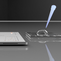 An illustration of a electronic tablet screen with a pipette tip having dropped a bead of water onto it